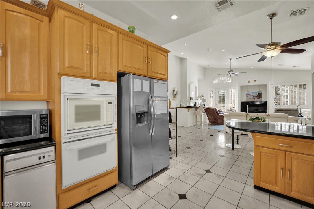 An open floorplan seamlessly connects the kitchen to the main living areas.
