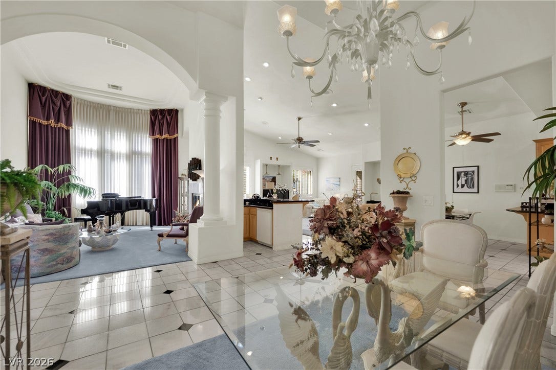 Gleaming tile floors and majestic arched columns define this elegant dining area.