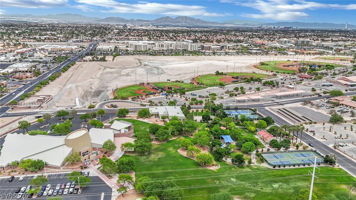 Panoramic mountain and city skyline views frame the nearby parks and recreational complexes.