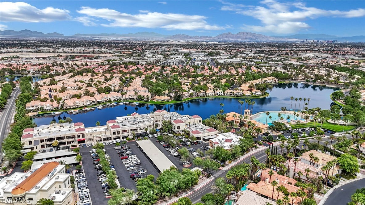 Sweeping neighborhood views showcase the beautiful surrounding lake and distant mountain ranges.