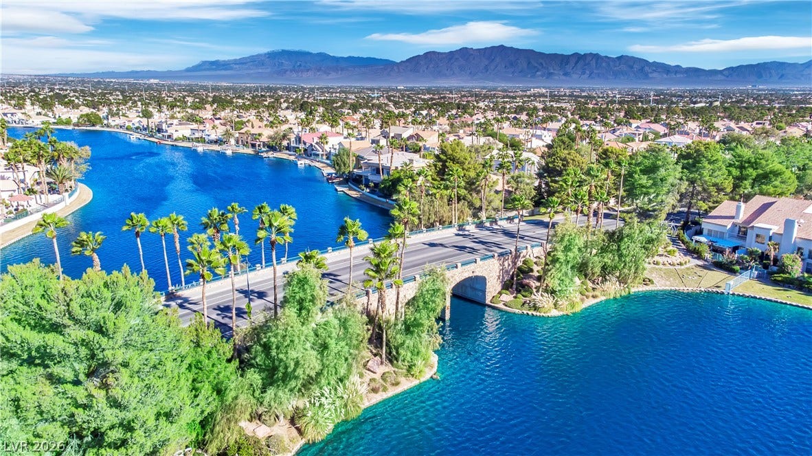 Panoramas of the sparkling lake and distant mountains define this serene neighborhood setting.