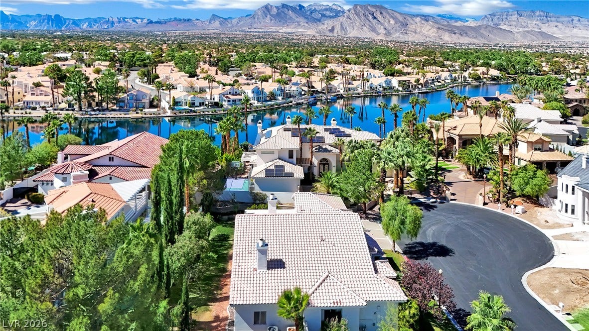 Lakeside living defines this neighborhood, bordered by a backdrop of rising mountains.