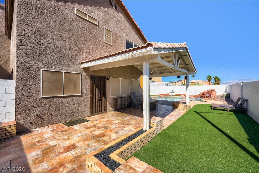 3536 Golden Pedal Street, Las Vegas, NV 89129 A spacious covered patio leads directly to the sunny backyard pool area.
