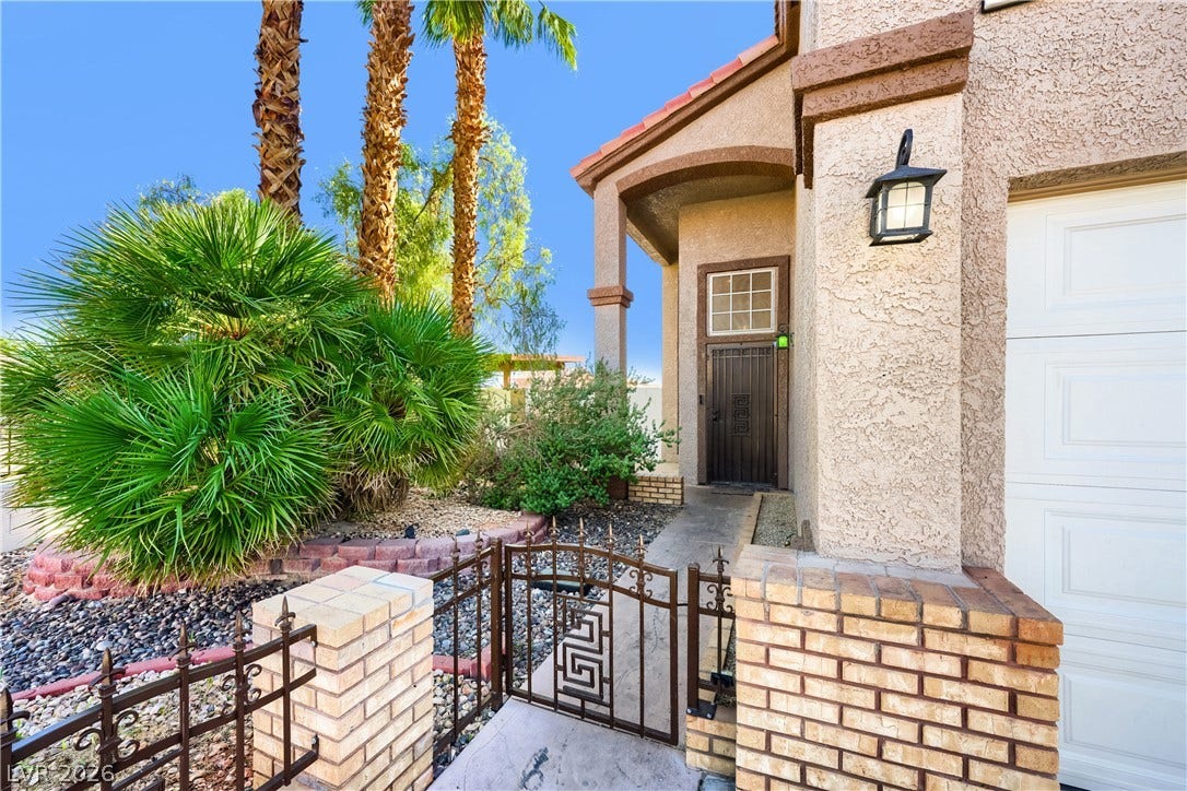 3536 Golden Pedal Street, Las Vegas, NV 89129 An inviting gated walkway leads past desert landscaping to the recessed front entry.