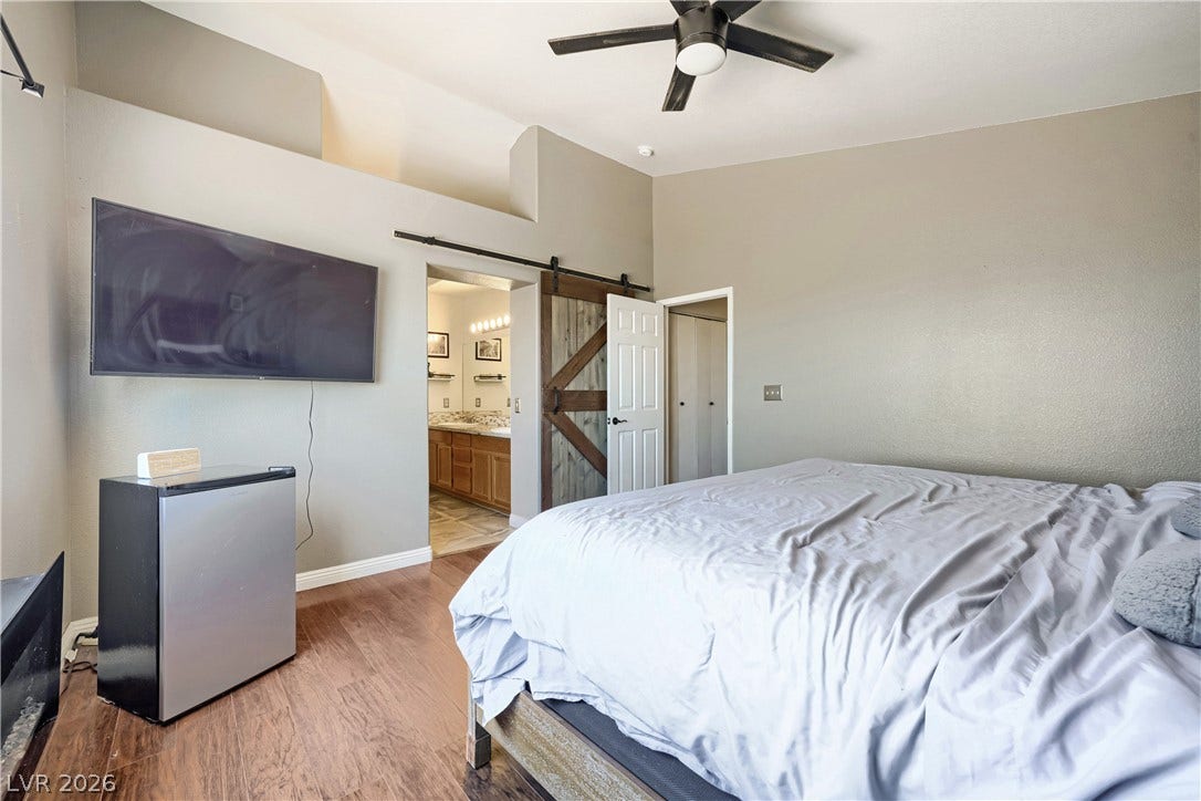 3536 Golden Pedal Street, Las Vegas, NV 89129 High ceilings and warm wood floors define this tranquil bedroom suite with attached bath.