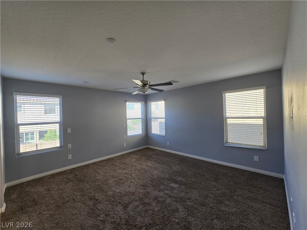 2926 Tremont Avenue, Henderson, NV 89052 Plush wall-to-wall carpeting and numerous windows define this versatile secondary bedroom space.