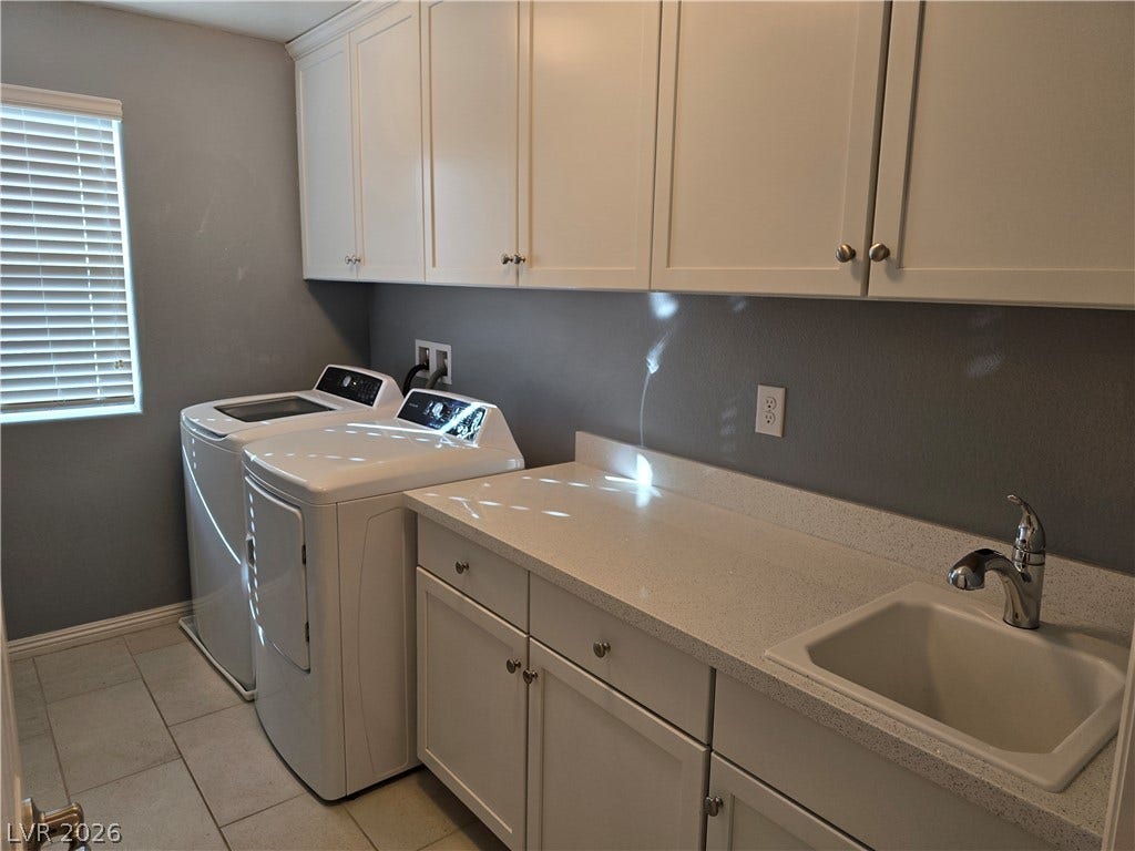 2926 Tremont Avenue, Henderson, NV 89052 Ample cabinetry and a convenient utility sink highlight this functional workspace.