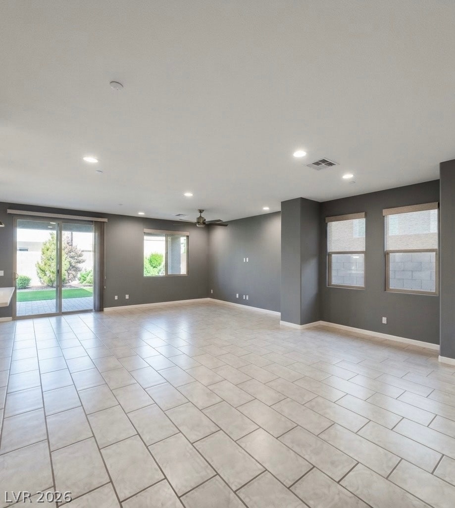2926 Tremont Avenue, Henderson, NV 89052 Gleaming tile floors stretch across a versatile, light-filled open living space.