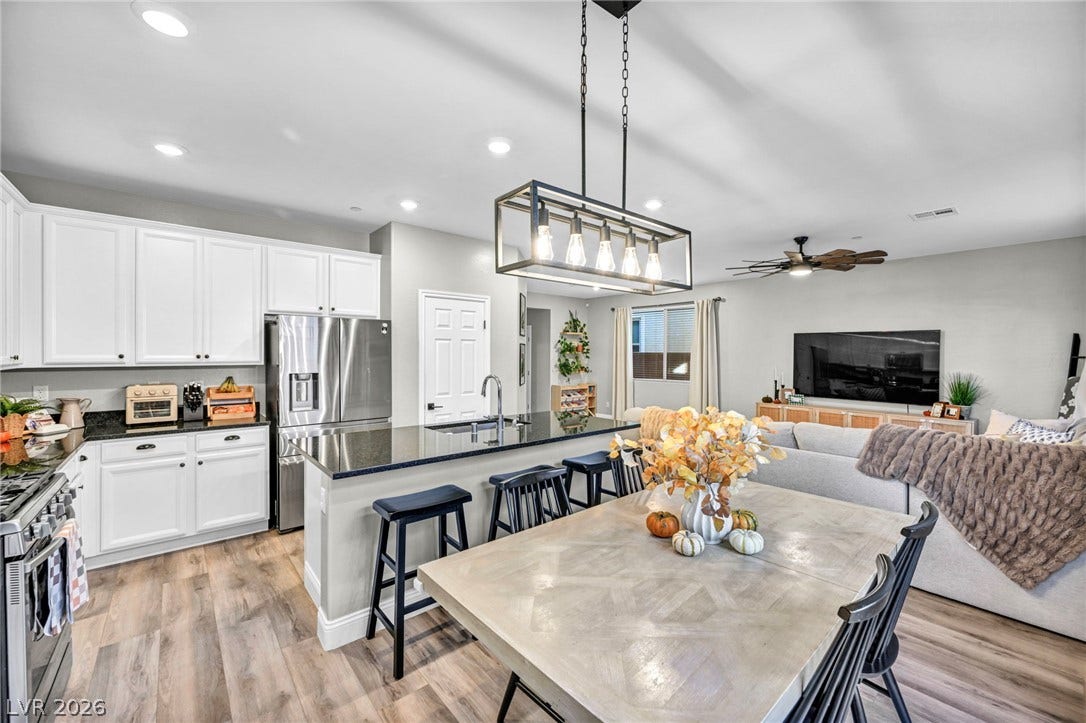 An open-concept layout connects the kitchen, dining area, and living space seamlessly.