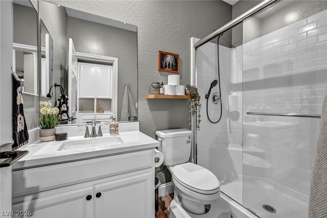 Crisp white cabinetry paired with classic subway tile defines this modern bathroom space.
