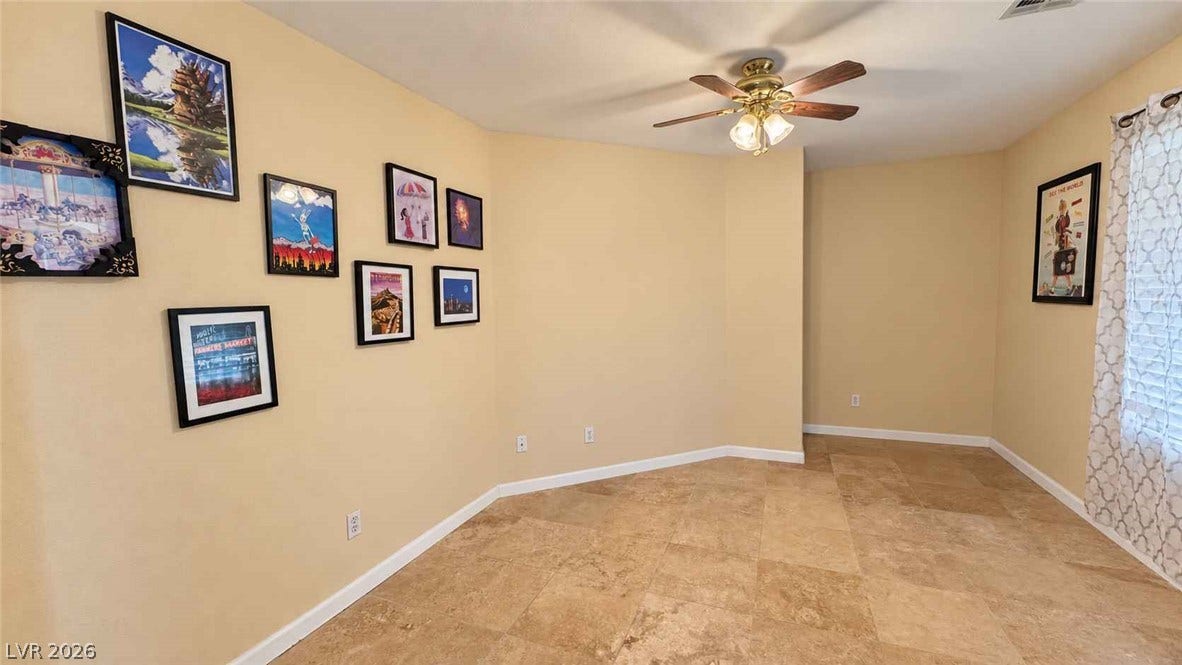 Polished tile flooring accents this versatile room ready for personalization.