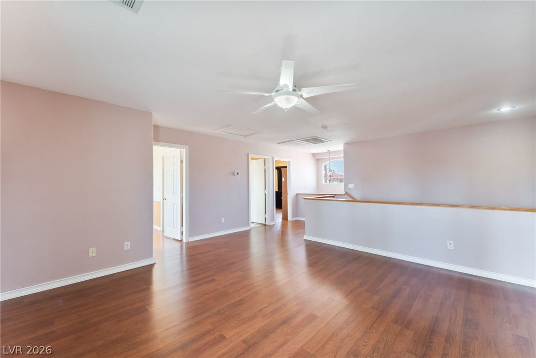 Gleaming hardwood floors and a spacious layout define this versatile upper-level loft space.