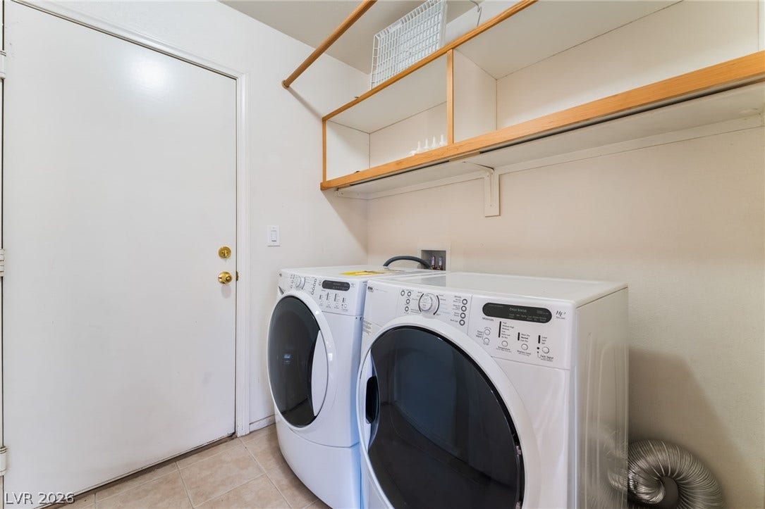 A functional utility space features durable flooring and built-in overhead storage shelves.Located on the first floor!