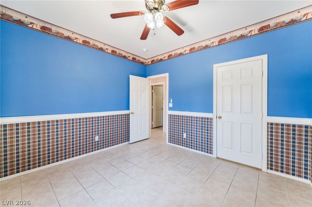 Tiled floors located on the first floor and a glass-paneled door leading to the backyard. highlight this versatile room.