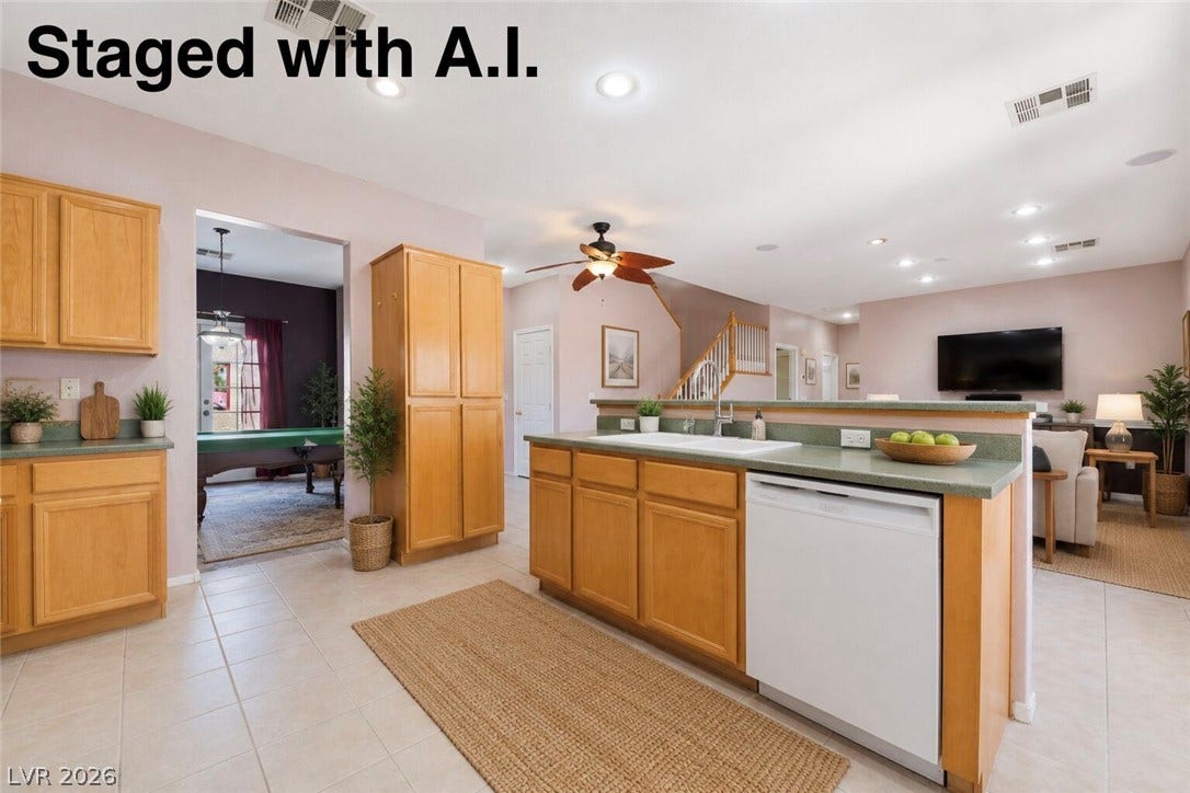 An open kitchen layout features clean tile flooring and classic wood cabinetry. Staged with A.I.