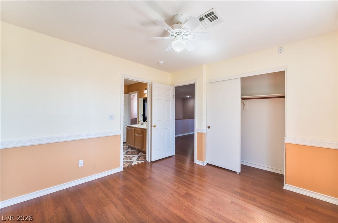 Polished wood floors and a built-in closet anchor this versatile space.