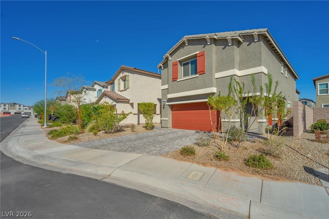 3428 Rush Avenue, Las Vegas, NV 89141 Stucco exterior siding and decorative window shutters define this modern multi-level suburban home.