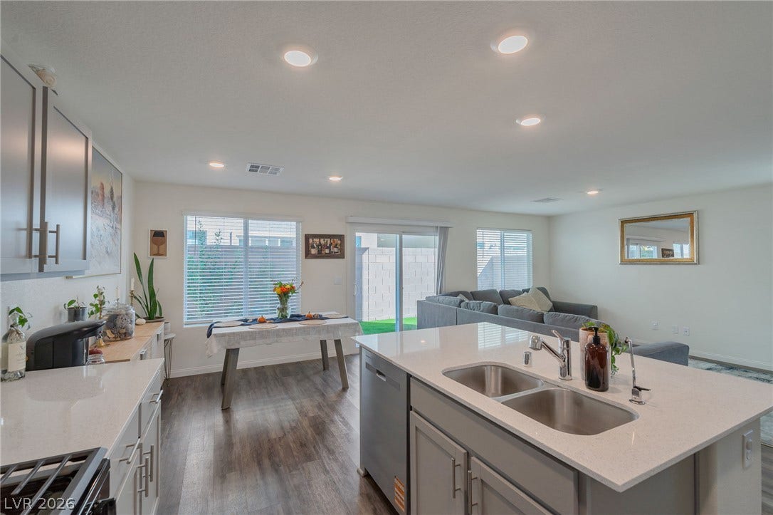 3428 Rush Avenue, Las Vegas, NV 89141 Recessed lighting and warm wood flooring enhance this open-concept layout.