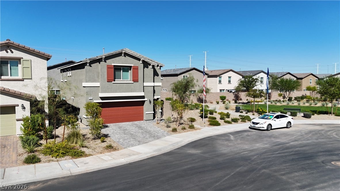 3428 Rush Avenue, Las Vegas, NV 89141 Clean lines and a paved driveway define this contemporary two-story home in a quiet neighborhood.