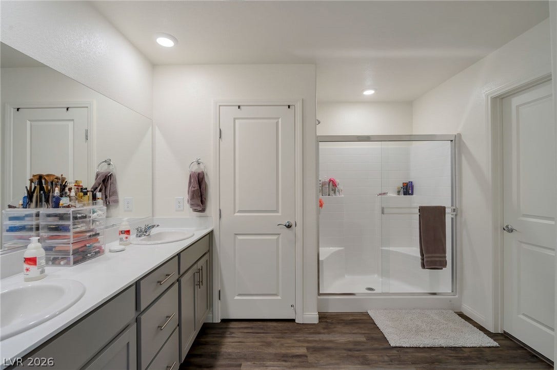 3428 Rush Avenue, Las Vegas, NV 89141 Clean lines and a spacious dual vanity define this modern bathroom layout.