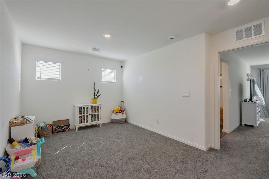 3428 Rush Avenue, Las Vegas, NV 89141 Plush carpeting and recessed lighting create a comfortable atmosphere in this versatile upper-level space.