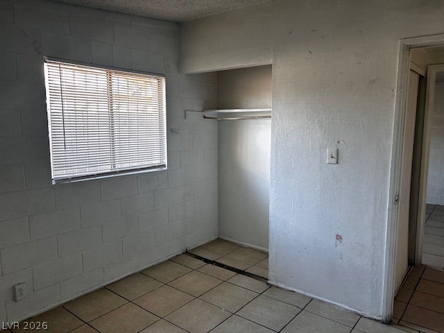3708 Perliter Avenue, North Las Vegas, NV 89030 Tiled flooring and a built-in closet alcove define this simple, functional interior space.
