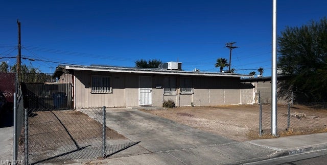 3708 Perliter Avenue, North Las Vegas, NV 89030 A classic single-story exterior features a paved driveway and a secured front yard.