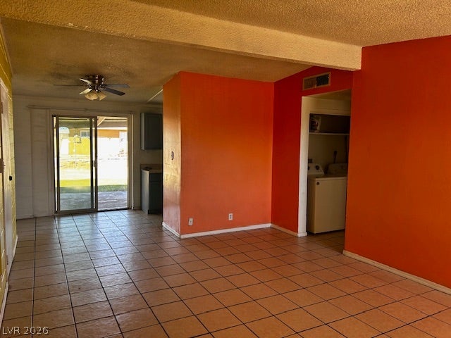 3708 Perliter Avenue, North Las Vegas, NV 89030 An open floorplan connects versatile living areas featuring classic tile flooring and sliding glass doors.