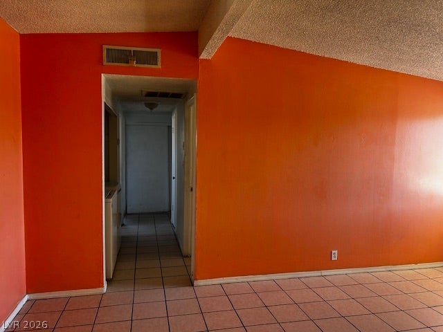 3708 Perliter Avenue, North Las Vegas, NV 89030 Tiled flooring extends throughout the spacious main area leading to an adjacent hallway.