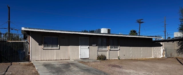 3708 Perliter Avenue, North Las Vegas, NV 89030 Single-story residence features a low-profile roofline and concrete driveway under clear blue skies.