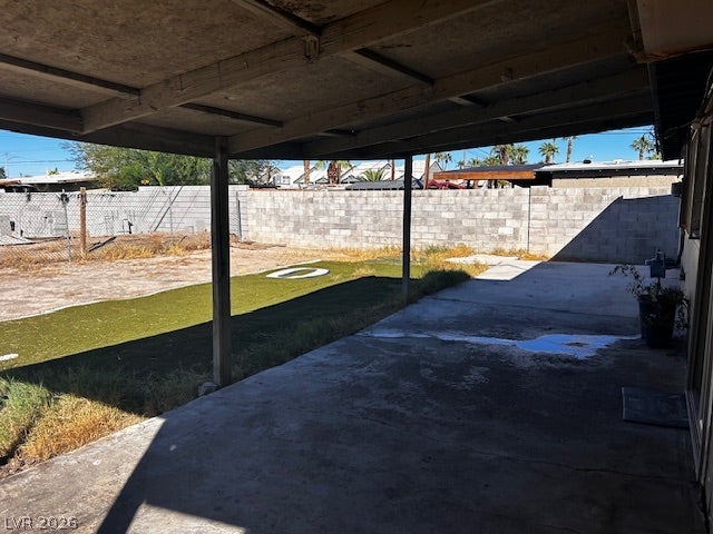 3708 Perliter Avenue, North Las Vegas, NV 89030 A spacious covered concrete patio overlooks the walled rear yard.