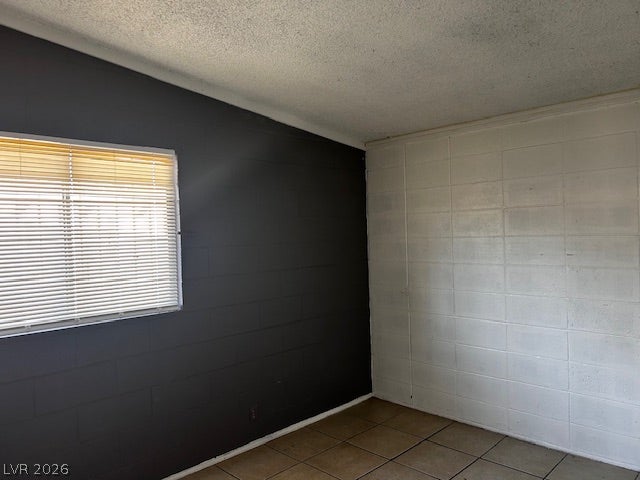 3708 Perliter Avenue, North Las Vegas, NV 89030 Tiled flooring and exposed block walls characterize this versatile interior space.
