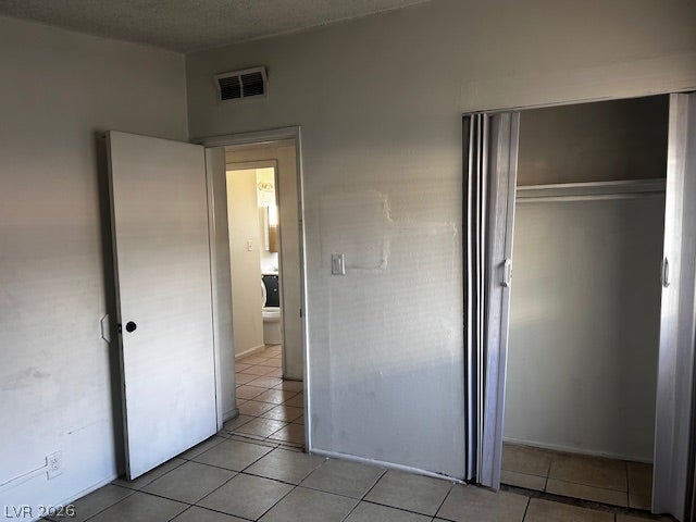 3708 Perliter Avenue, North Las Vegas, NV 89030 Tiled flooring and a built-in closet define this versatile interior space.