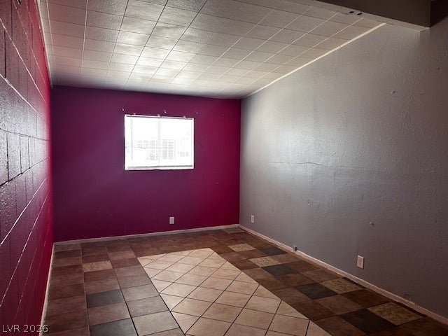 3708 Perliter Avenue, North Las Vegas, NV 89030 A single window provides natural light to this room featuring tiled flooring.
