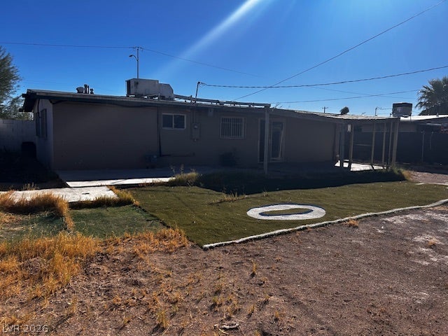 3708 Perliter Avenue, North Las Vegas, NV 89030 Sun-drenched backyard area features a concrete patio and functional outdoor space.