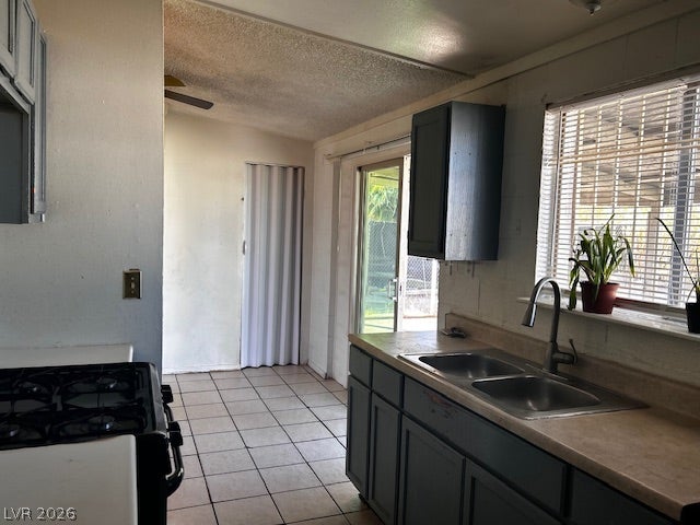 3708 Perliter Avenue, North Las Vegas, NV 89030 Tiled flooring flows through a functional cooking space with direct outdoor access.