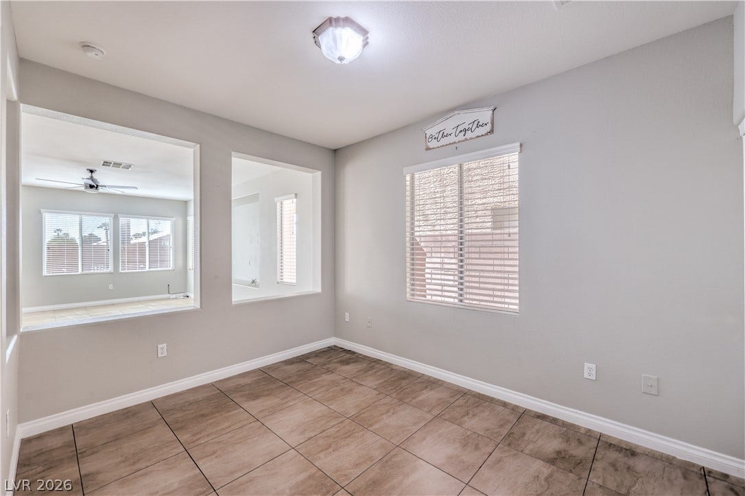 Durable tile flooring highlights this versatile space with interior pass-through windows.