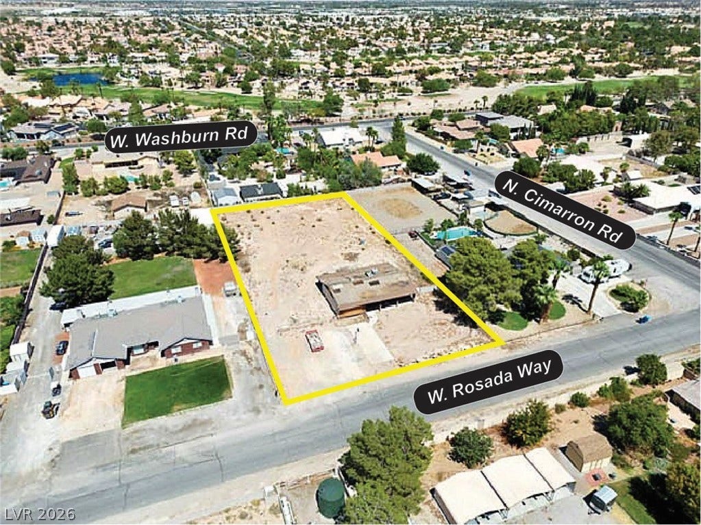 8010 W Rosada Way, Las Vegas, NV 89149 An aerial perspective reveals the expansive property lot outlined within a quiet neighborhood setting.
