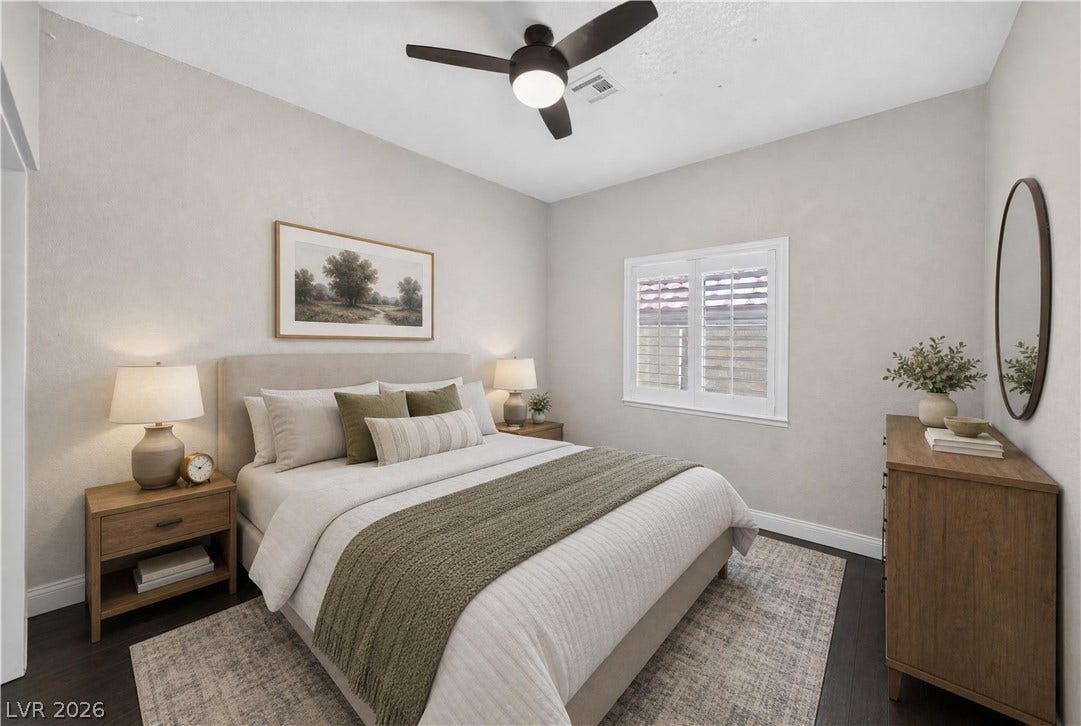 1740 Bluffs Drive, Henderson, NV 89014 This photo is virtually staged. Gleaming hardwood floors and a plantation-shuttered window define this serene bedroom space.