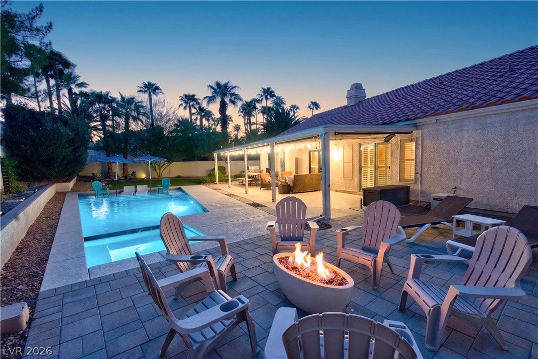 1740 Bluffs Drive, Henderson, NV 89014 A sparkling swimming pool and paved patio create an ideal setting for outdoor relaxation.