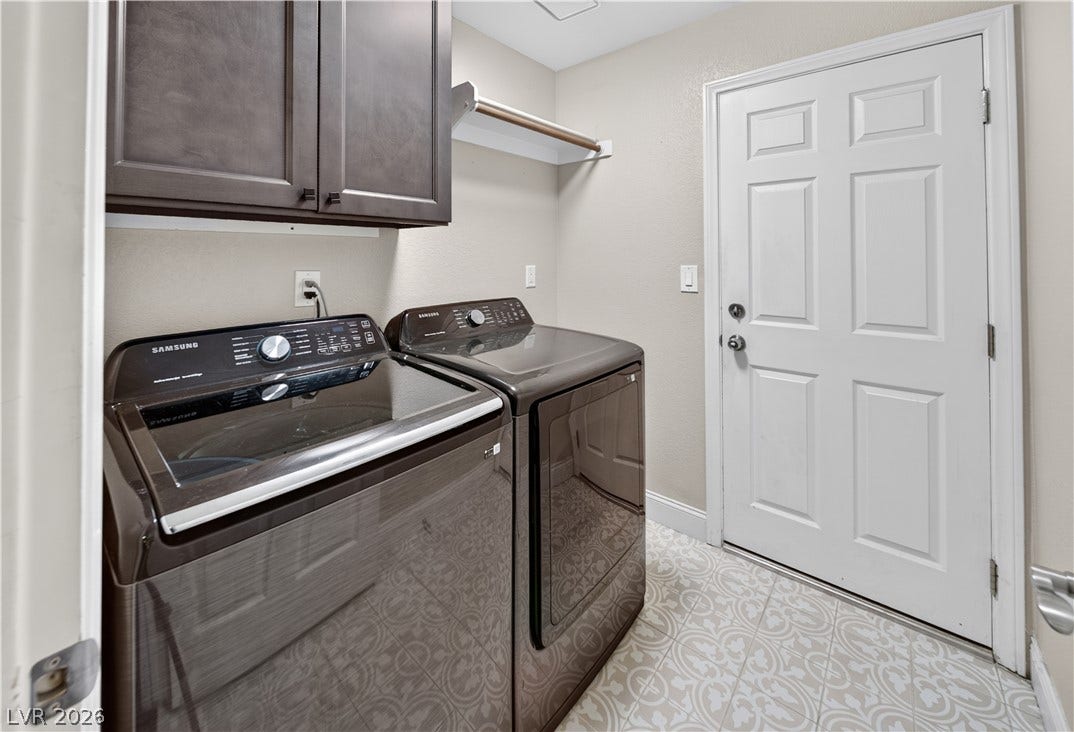 1740 Bluffs Drive, Henderson, NV 89014 Patterned tile flooring and dark cabinetry bring functional style to this dedicated utility space.
