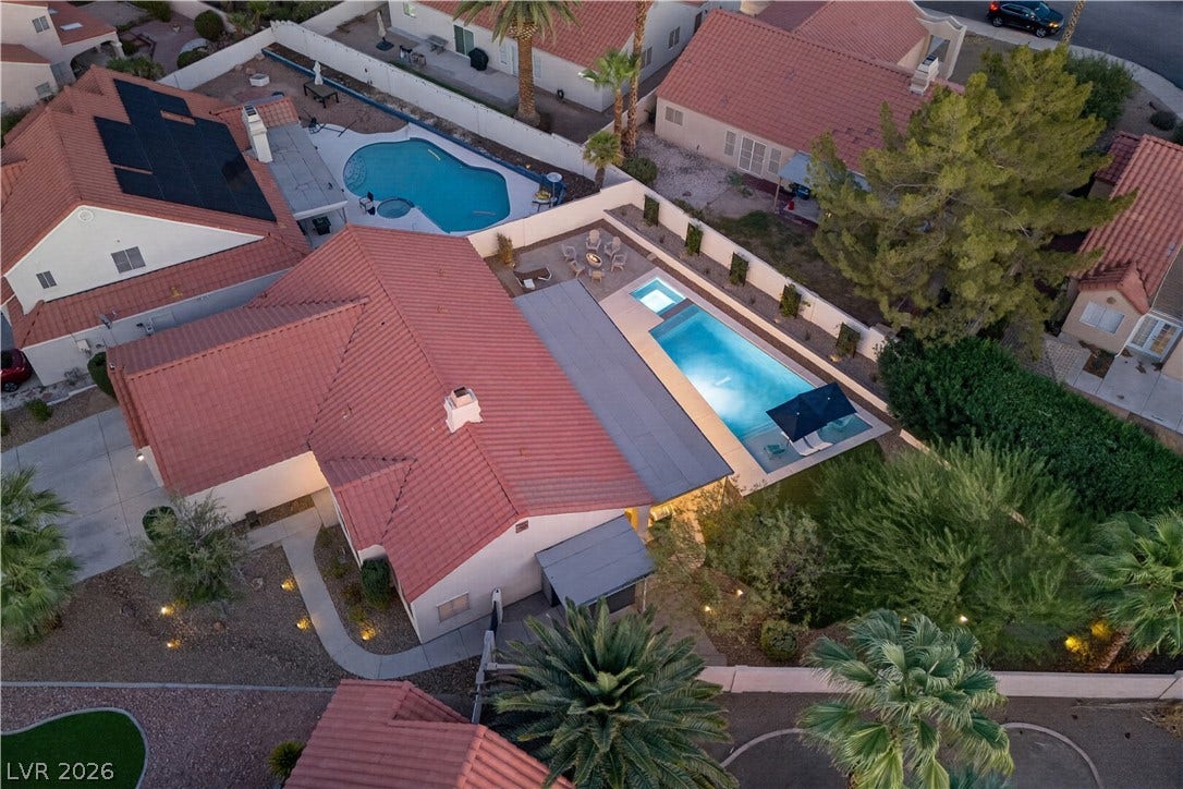 1740 Bluffs Drive, Henderson, NV 89014 Spanish tile roofing and a private swimming pool define this desert backyard oasis.