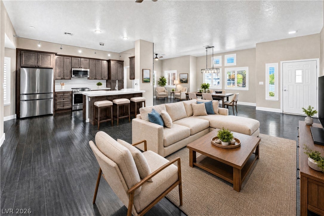1740 Bluffs Drive, Henderson, NV 89014 An open floorplan seamlessly connects the airy living space to a modern kitchen.