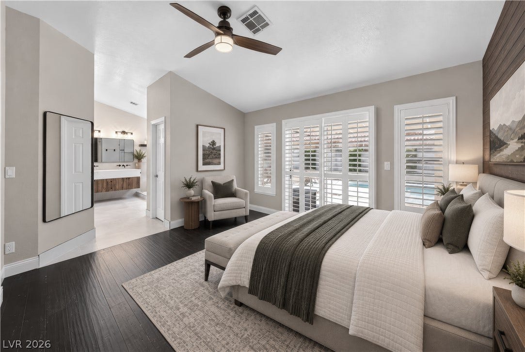 1740 Bluffs Drive, Henderson, NV 89014 This photo is virtually staged. Rich dark wood flooring and plantation shutters define this serene main-level retreat.