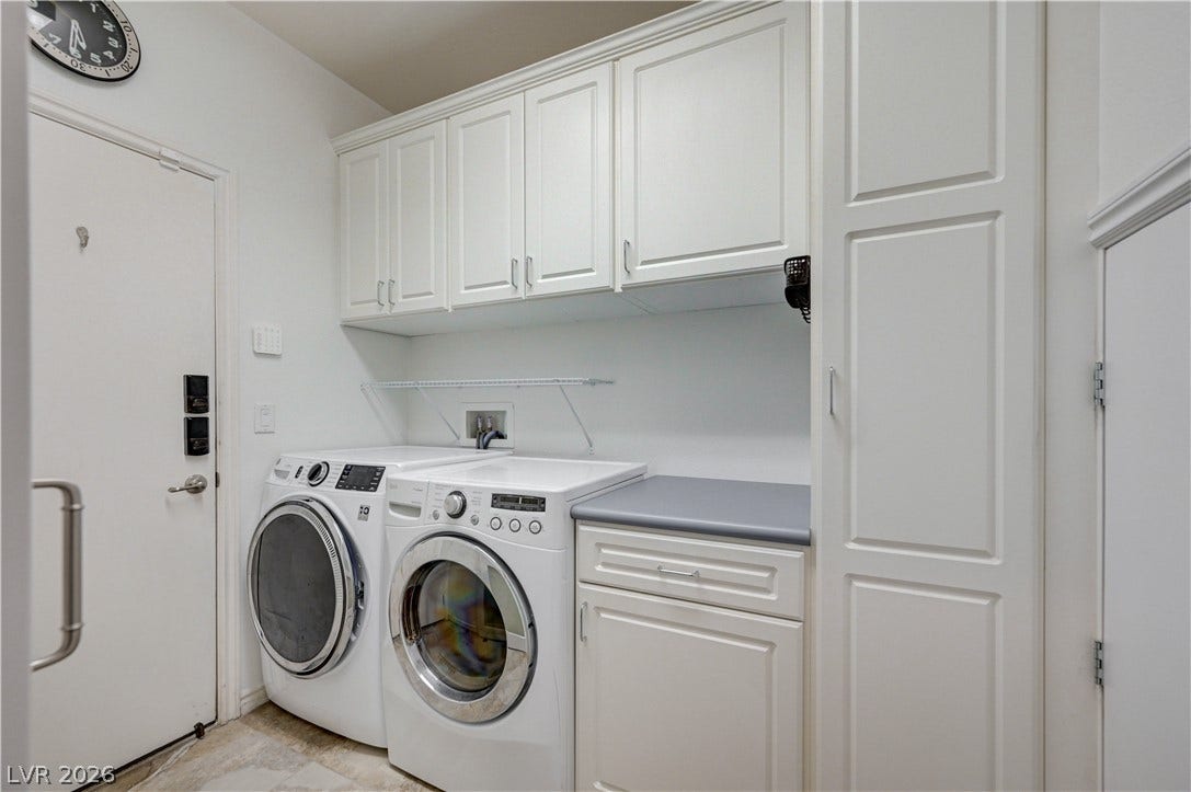4120 Hawks Glide Avenue, North Las Vegas, NV 89084 Ample built-in cabinetry provides extensive storage options alongside the dedicated laundry setup.