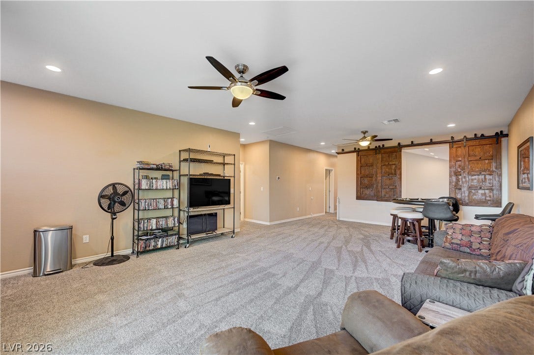4120 Hawks Glide Avenue, North Las Vegas, NV 89084 An open and carpeted space provides versatile areas for relaxation and entertainment.