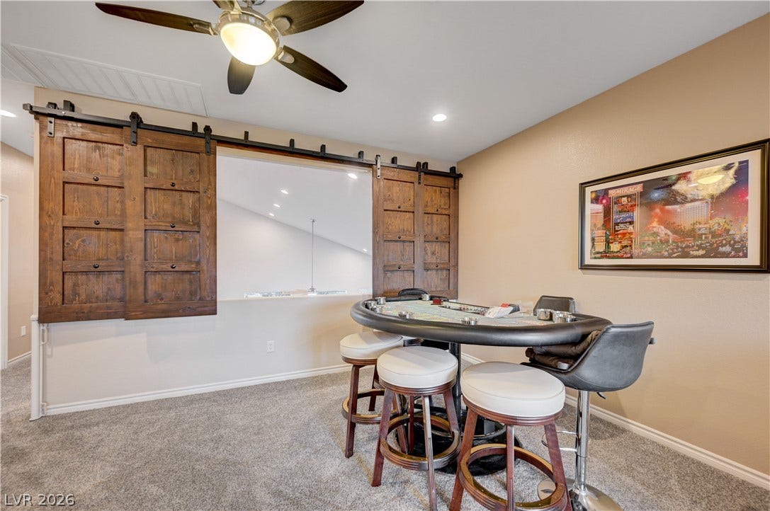 4120 Hawks Glide Avenue, North Las Vegas, NV 89084 Sliding barn doors overlook the level below from this versatile upper-level bonus space.