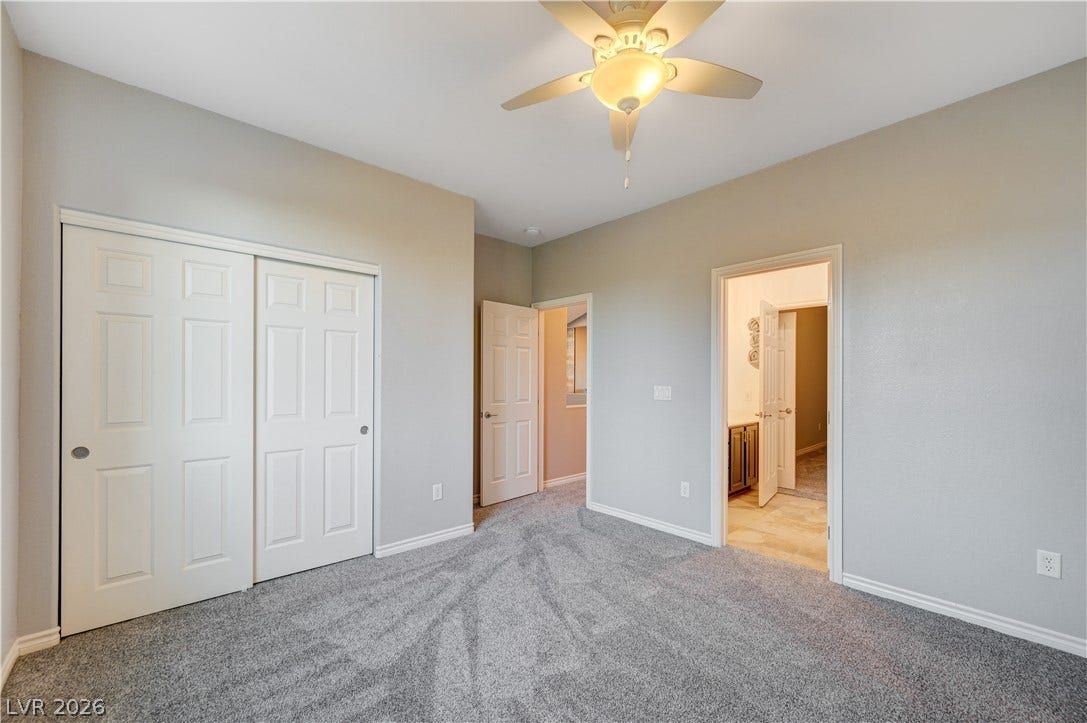 4120 Hawks Glide Avenue, North Las Vegas, NV 89084 Soft carpeting pairs with neutral walls in this versatile bedroom space.