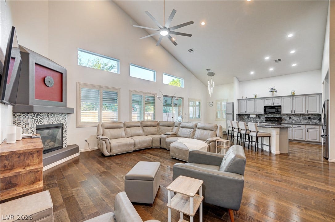 4120 Hawks Glide Avenue, North Las Vegas, NV 89084 Soaring vaulted ceilings and rich wood floors anchor this expansive open-concept living area.