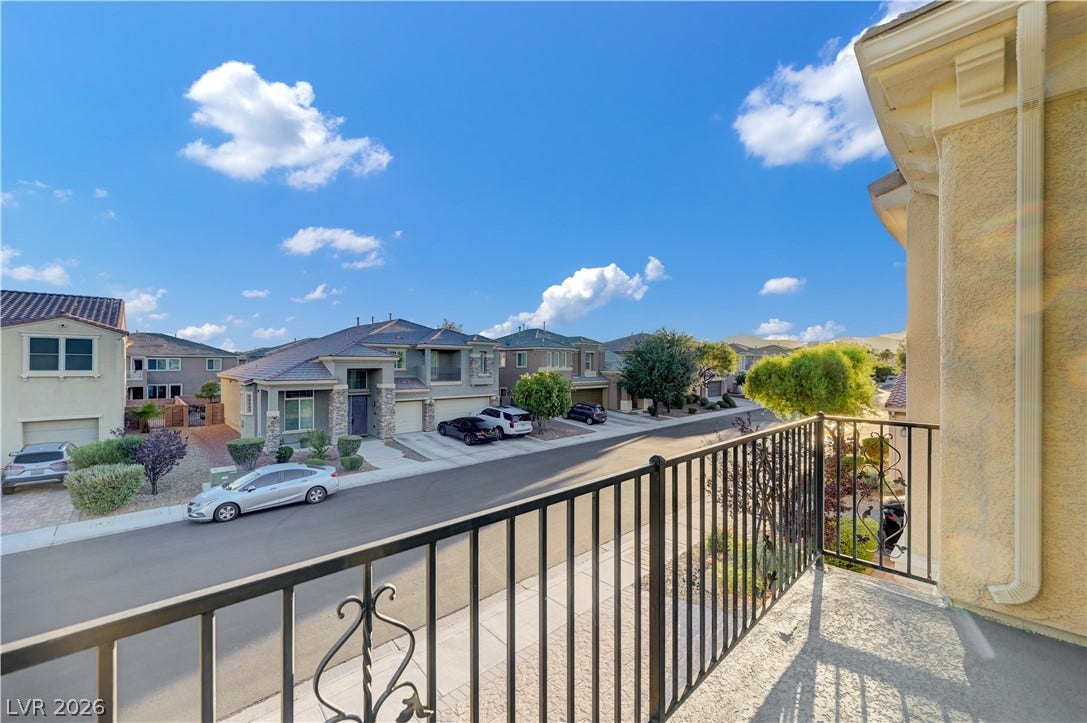 4120 Hawks Glide Avenue, North Las Vegas, NV 89084 An elevated perspective overlooks the quiet residential street from this balcony.